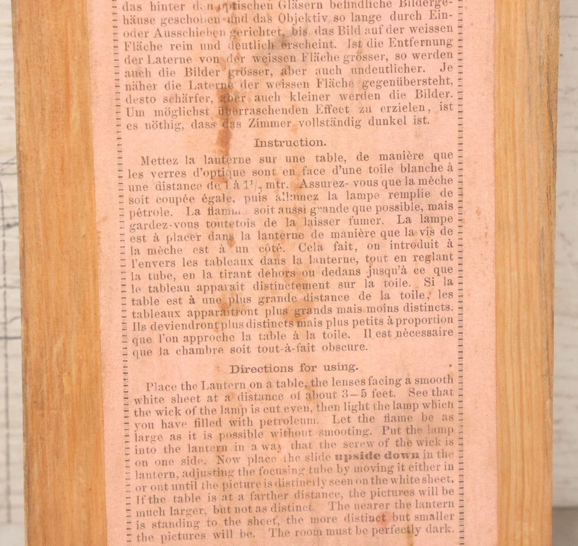 Lot 005 - Antique Magic Lantern Projector In Original Box With Eleven Slides, On Base With Storage Compartment, Original Paper Label Instructions, By Ernst Plank Company, Nuremberg, Germany, Note Missing Metal Chimney