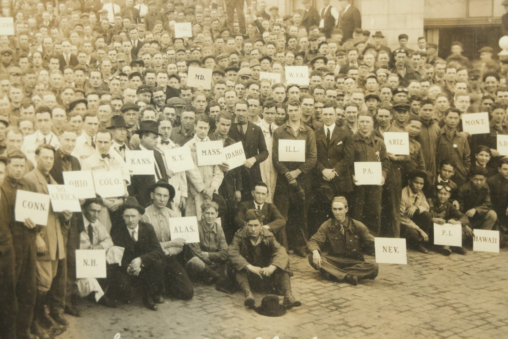Lot 009 - Antique Framed "Yard-Long" Group Photograph Of The Students Of Sweeney Auto School, April 14th, 1921, Photo Taken By Riederer, Kansas City, Missouri, Note Texas Man On Motorcycle, 21" x 9-1/4"