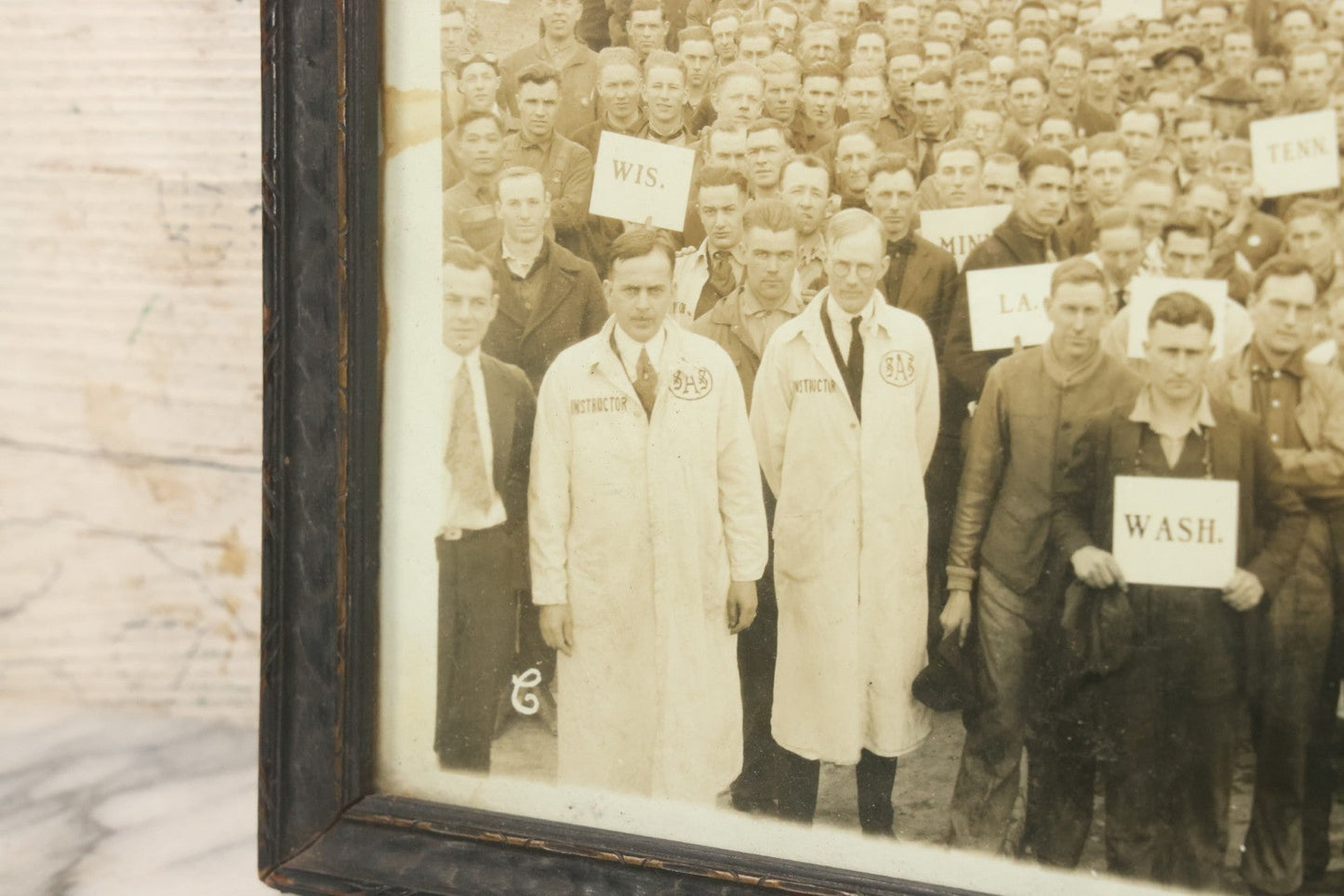 Lot 009 - Antique Framed "Yard-Long" Group Photograph Of The Students Of Sweeney Auto School, April 14th, 1921, Photo Taken By Riederer, Kansas City, Missouri, Note Texas Man On Motorcycle, 21" x 9-1/4"