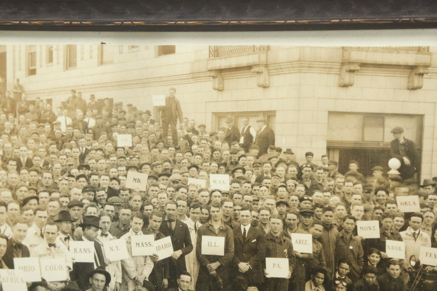 Lot 009 - Antique Framed "Yard-Long" Group Photograph Of The Students Of Sweeney Auto School, April 14th, 1921, Photo Taken By Riederer, Kansas City, Missouri, Note Texas Man On Motorcycle, 21" x 9-1/4"
