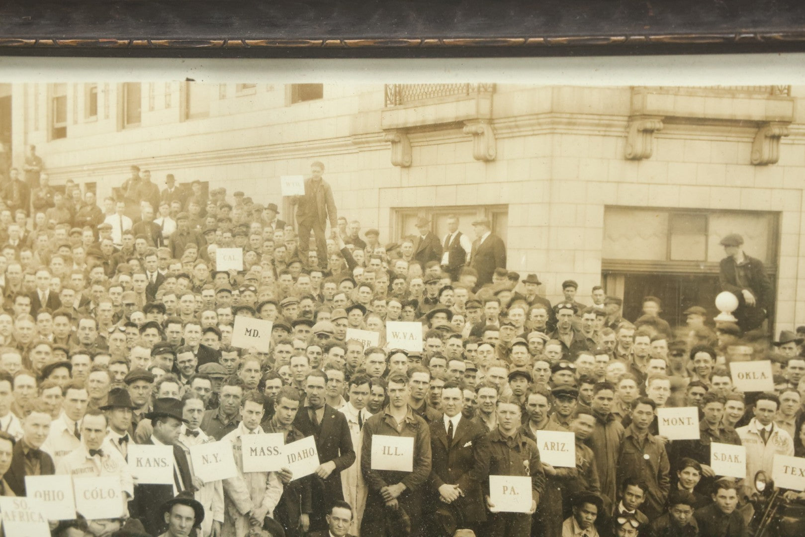 Lot 009 - Antique Framed "Yard-Long" Group Photograph Of The Students Of Sweeney Auto School, April 14th, 1921, Photo Taken By Riederer, Kansas City, Missouri, Note Texas Man On Motorcycle, 21" x 9-1/4"