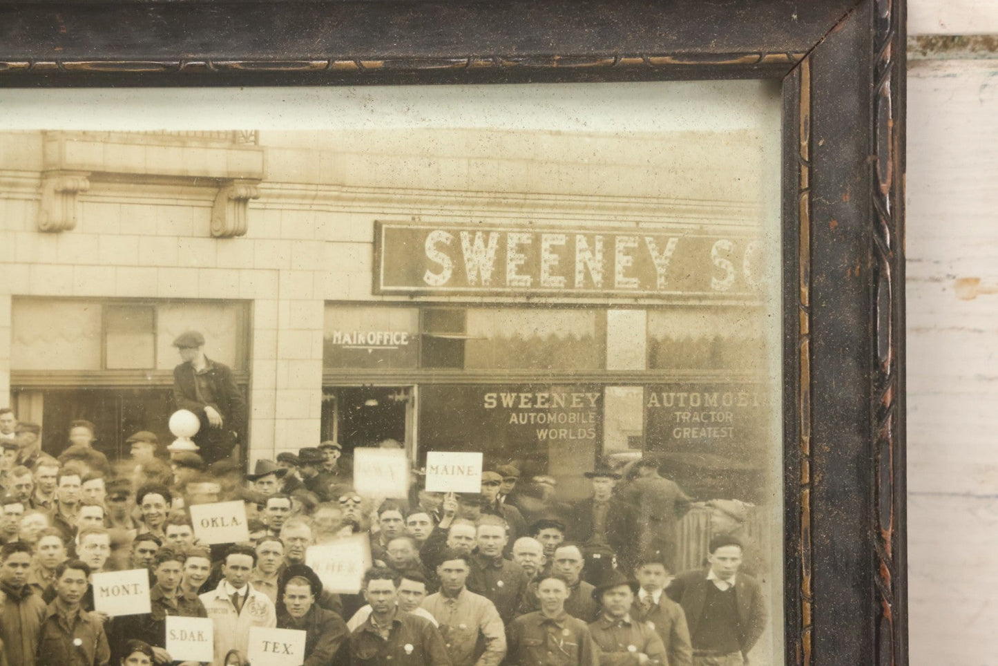 Lot 009 - Antique Framed "Yard-Long" Group Photograph Of The Students Of Sweeney Auto School, April 14th, 1921, Photo Taken By Riederer, Kansas City, Missouri, Note Texas Man On Motorcycle, 21" x 9-1/4"
