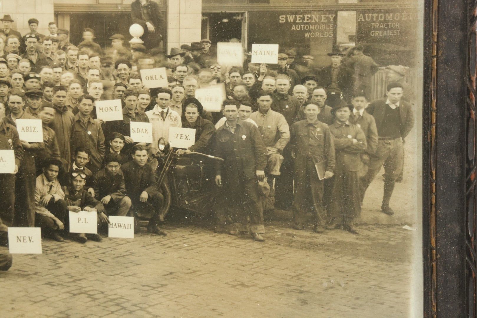 Lot 009 - Antique Framed "Yard-Long" Group Photograph Of The Students Of Sweeney Auto School, April 14th, 1921, Photo Taken By Riederer, Kansas City, Missouri, Note Texas Man On Motorcycle, 21" x 9-1/4"
