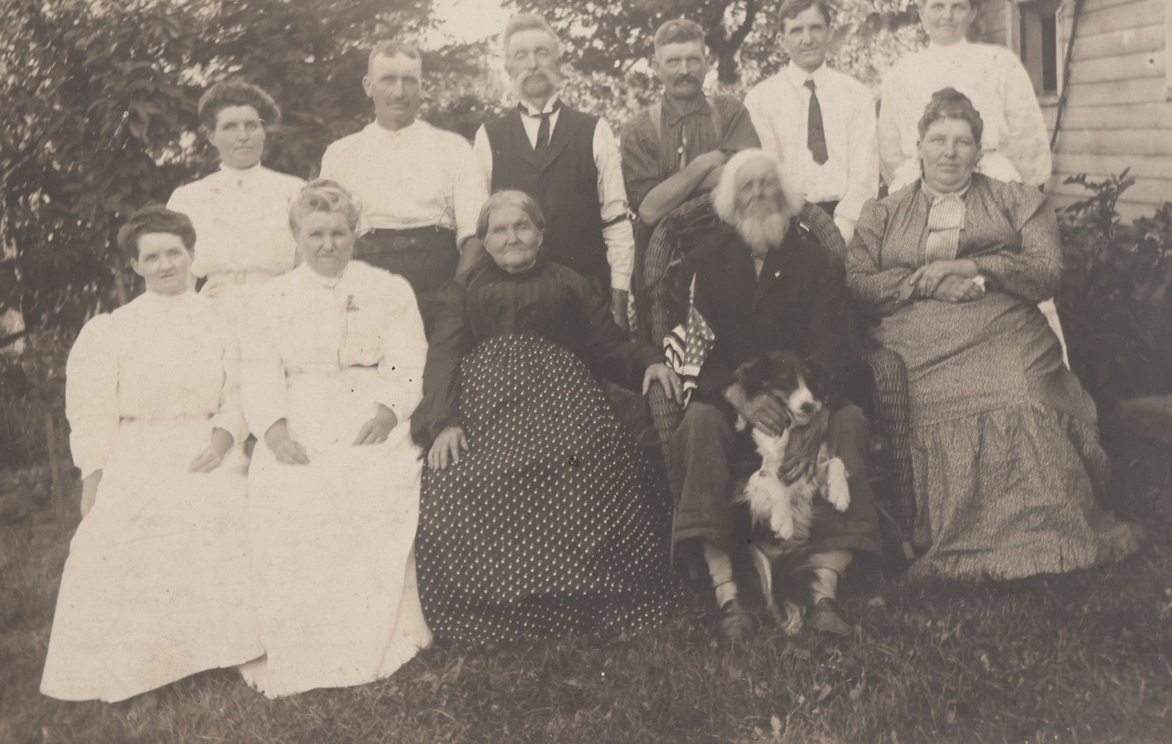 Lot 081 - Antique Boarded Photograph Of Family Gathering Including An Elderly Man Holding Border Collie Dog With American Flag
