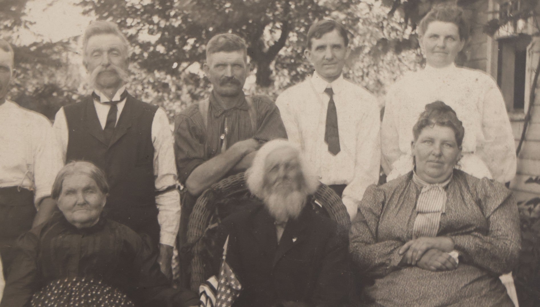 Lot 081 - Antique Boarded Photograph Of Family Gathering Including An Elderly Man Holding Border Collie Dog With American Flag