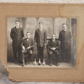 Lot 084 - Antique Boarded Photograph Of Bowling Team Of Five Men Posing With Three Bowling Pins And Bowling Ball, Note Loss To Lower Left Corner, Hole To Left Of Center Mans Head