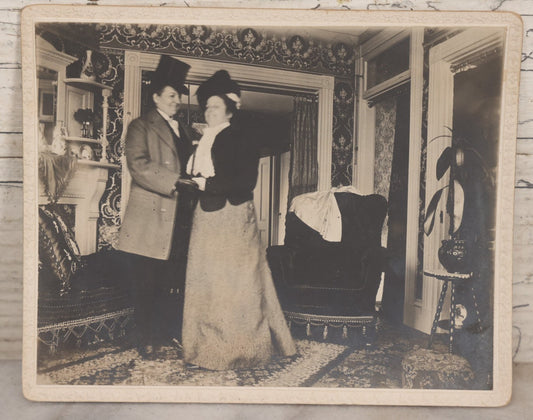 Lot 087 - Antique Boarded Interior Photograph Of Two Women, One Dressed In Suit And Top Hat, Dancing In Parlor