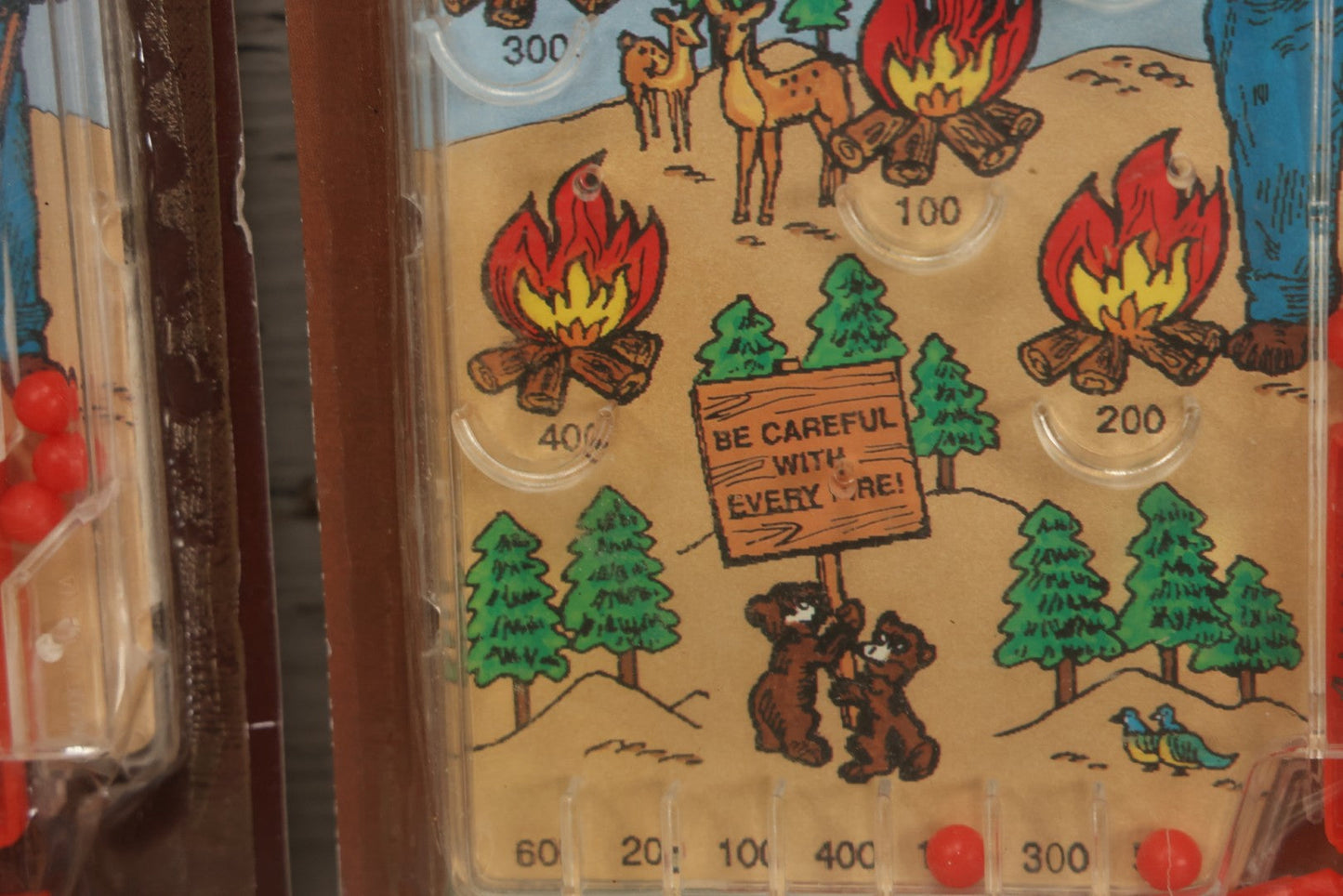 Lot 089 - Grouping Of Eight New Old Stock N.O.S. Smokey Bear "Put Out The Fires..." Pinball Game, Manufactured By Gordy International, Inc., Plainfield, New Jersey, No. 476, Made In China