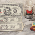 Lot 090 - Miscellaneous Novelties Grouping Including Casper The Friendly Ghost Push Button Puppet, Rusty Sex Pinback Button, Four "Inflated States Of America" Richard Nixon Dollars, Little Tacos 3D View Comic Book, Toy Sports Car, And Tin Fish