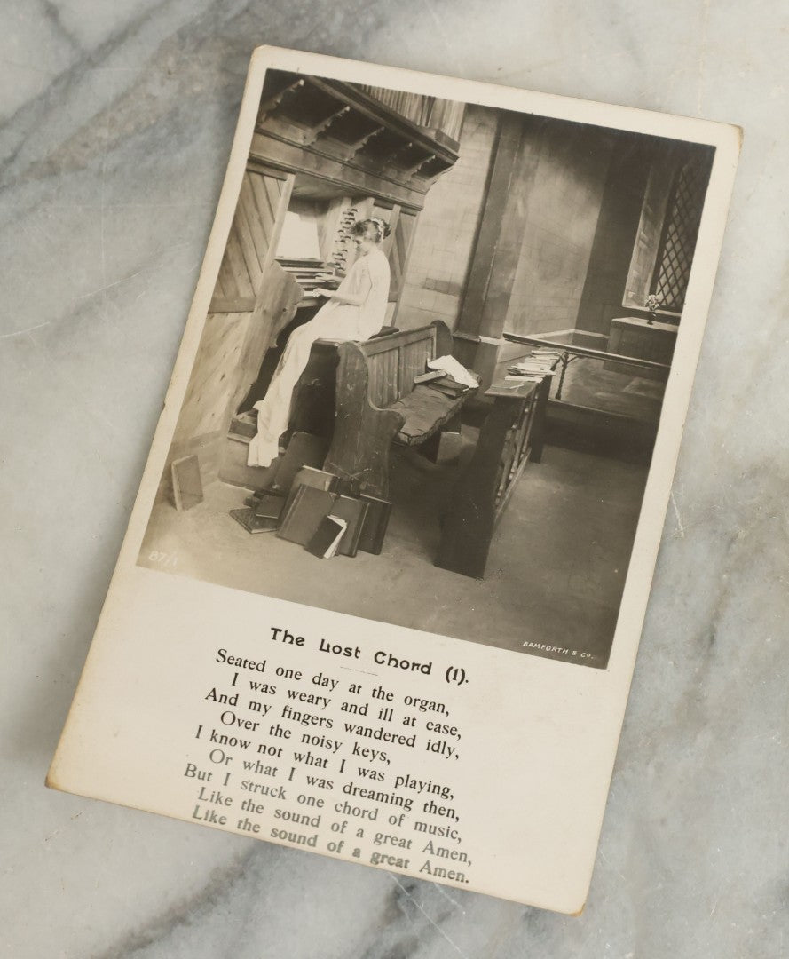 Lot 097 - Grouping Of 35 Antique Photographic Postcards From Bamforth's "Life Model Series," England And New York City, With Many Posed Studio Photographs And Series Including Rock Of Ages, The Little Hero, Excelsior, And Others