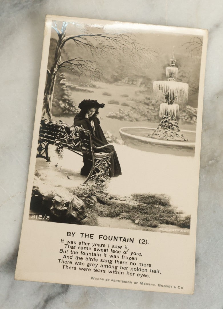 Lot 097 - Grouping Of 35 Antique Photographic Postcards From Bamforth's "Life Model Series," England And New York City, With Many Posed Studio Photographs And Series Including Rock Of Ages, The Little Hero, Excelsior, And Others