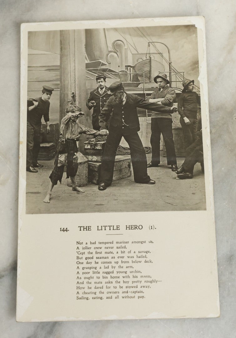 Lot 097 - Grouping Of 35 Antique Photographic Postcards From Bamforth's "Life Model Series," England And New York City, With Many Posed Studio Photographs And Series Including Rock Of Ages, The Little Hero, Excelsior, And Others