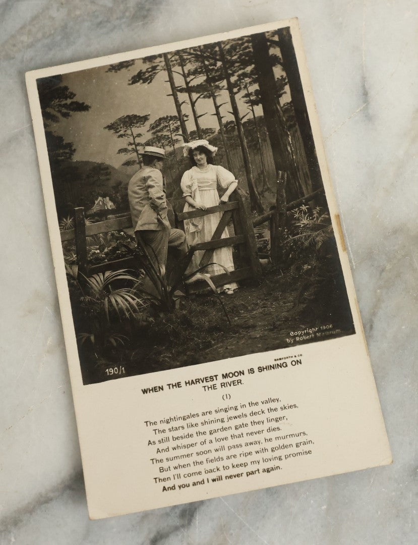 Lot 097 - Grouping Of 35 Antique Photographic Postcards From Bamforth's "Life Model Series," England And New York City, With Many Posed Studio Photographs And Series Including Rock Of Ages, The Little Hero, Excelsior, And Others