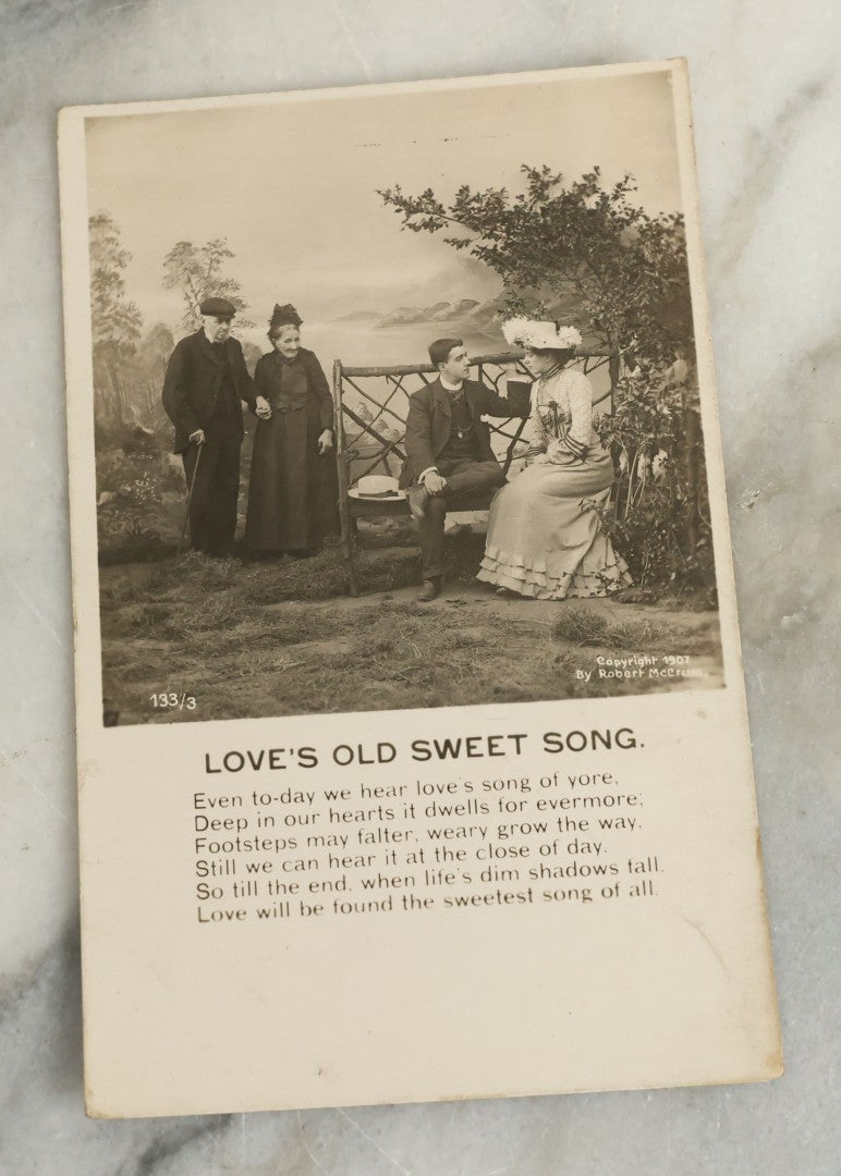 Lot 097 - Grouping Of 35 Antique Photographic Postcards From Bamforth's "Life Model Series," England And New York City, With Many Posed Studio Photographs And Series Including Rock Of Ages, The Little Hero, Excelsior, And Others