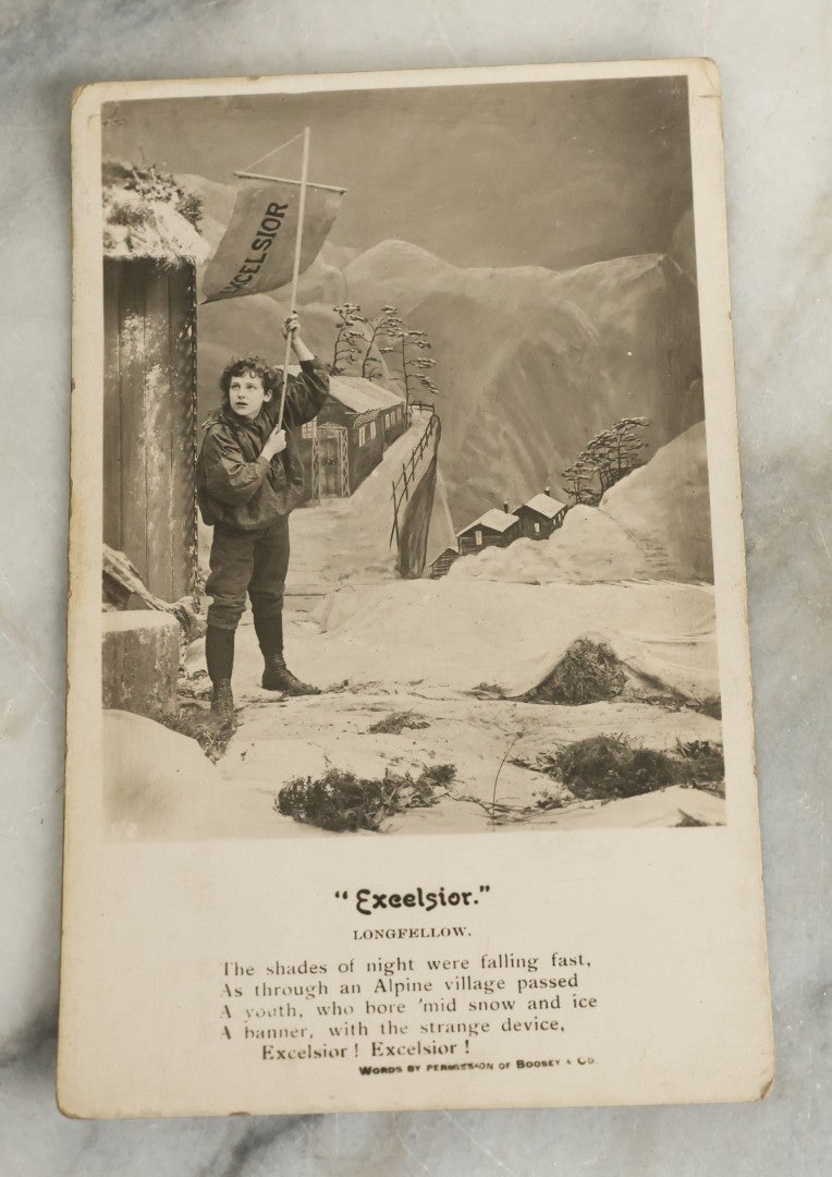 Lot 097 - Grouping Of 35 Antique Photographic Postcards From Bamforth's "Life Model Series," England And New York City, With Many Posed Studio Photographs And Series Including Rock Of Ages, The Little Hero, Excelsior, And Others