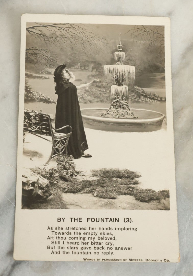 Lot 097 - Grouping Of 35 Antique Photographic Postcards From Bamforth's "Life Model Series," England And New York City, With Many Posed Studio Photographs And Series Including Rock Of Ages, The Little Hero, Excelsior, And Others