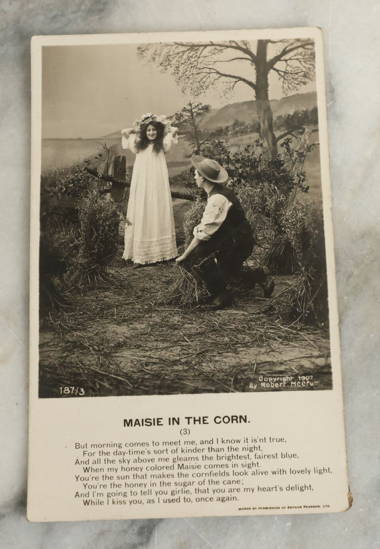 Lot 097 - Grouping Of 35 Antique Photographic Postcards From Bamforth's "Life Model Series," England And New York City, With Many Posed Studio Photographs And Series Including Rock Of Ages, The Little Hero, Excelsior, And Others