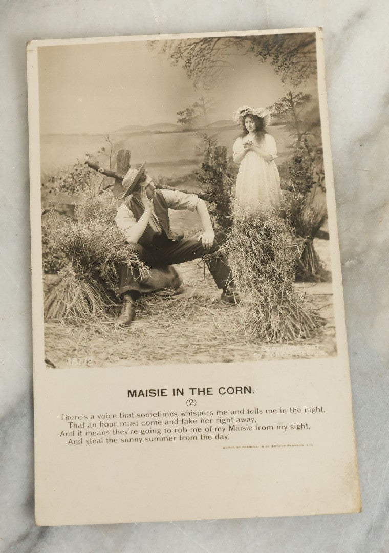 Lot 097 - Grouping Of 35 Antique Photographic Postcards From Bamforth's "Life Model Series," England And New York City, With Many Posed Studio Photographs And Series Including Rock Of Ages, The Little Hero, Excelsior, And Others
