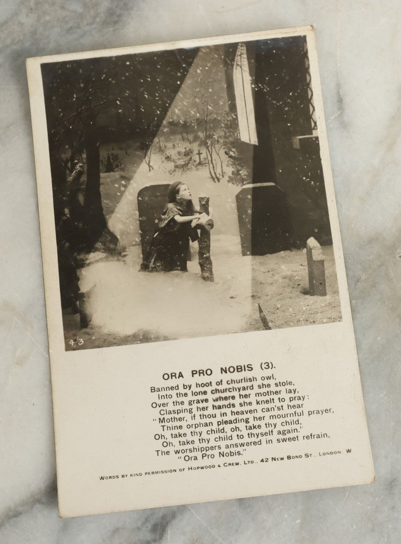 Lot 097 - Grouping Of 35 Antique Photographic Postcards From Bamforth's "Life Model Series," England And New York City, With Many Posed Studio Photographs And Series Including Rock Of Ages, The Little Hero, Excelsior, And Others