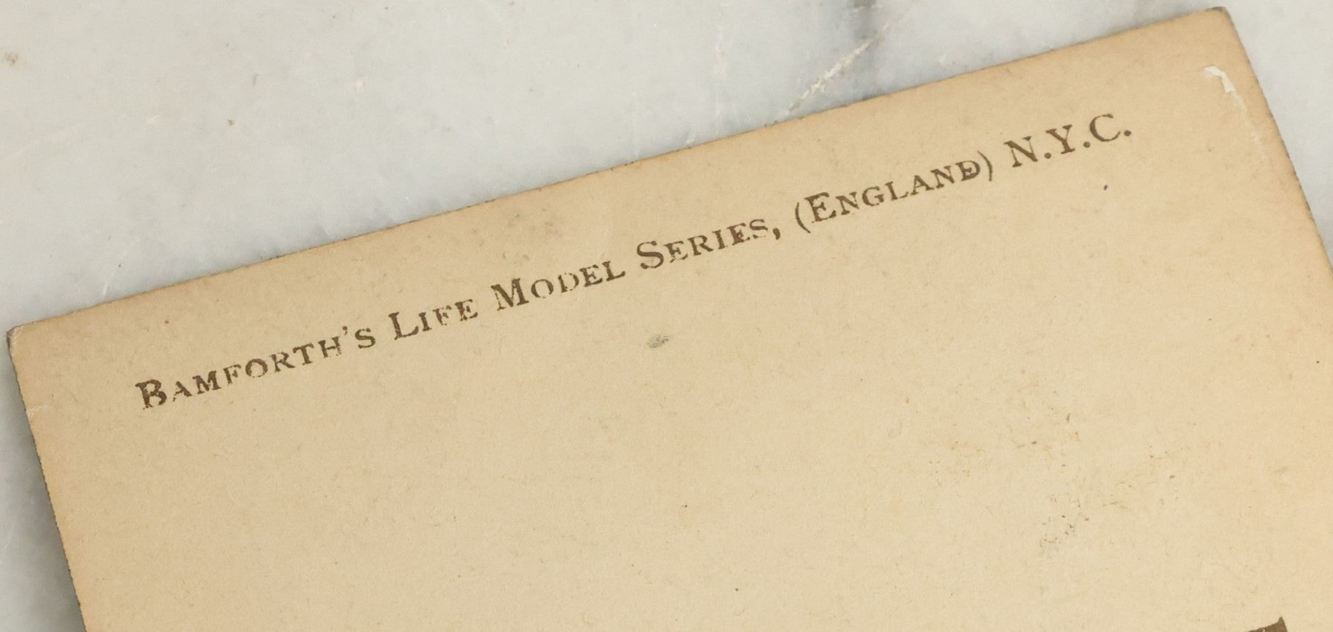 Lot 097 - Grouping Of 35 Antique Photographic Postcards From Bamforth's "Life Model Series," England And New York City, With Many Posed Studio Photographs And Series Including Rock Of Ages, The Little Hero, Excelsior, And Others