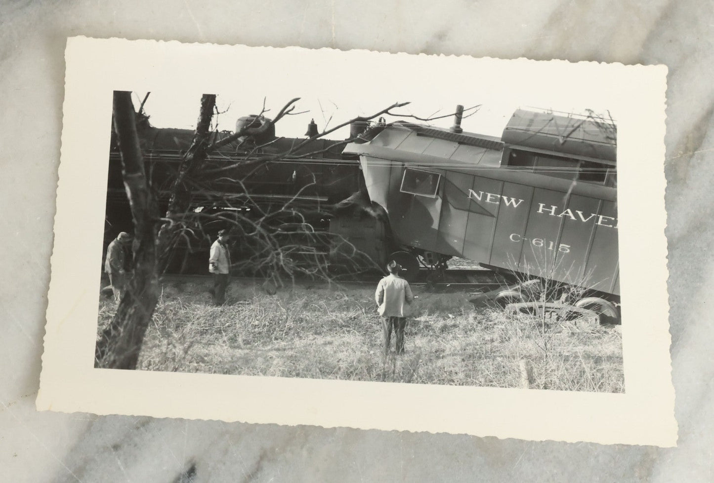 Lot 107 - Grouping Of Five Vintage Snapshot Photographs Showing A Railroad Collision And Derailment With A New Haven Caboose And A Locomotive With Trust Bridge Visible In Background, Circa 1940