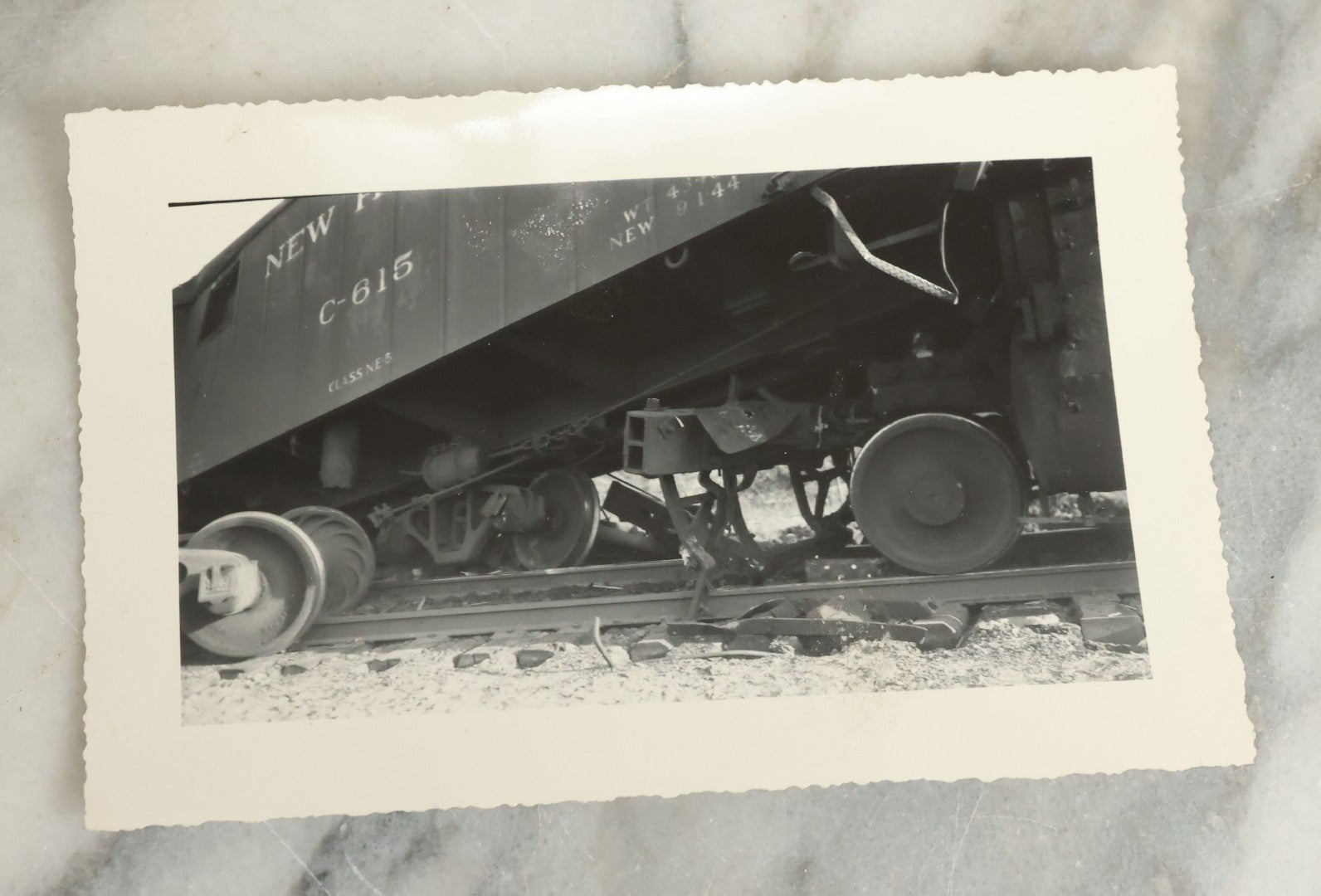 Lot 107 - Grouping Of Five Vintage Snapshot Photographs Showing A Railroad Collision And Derailment With A New Haven Caboose And A Locomotive With Trust Bridge Visible In Background, Circa 1940