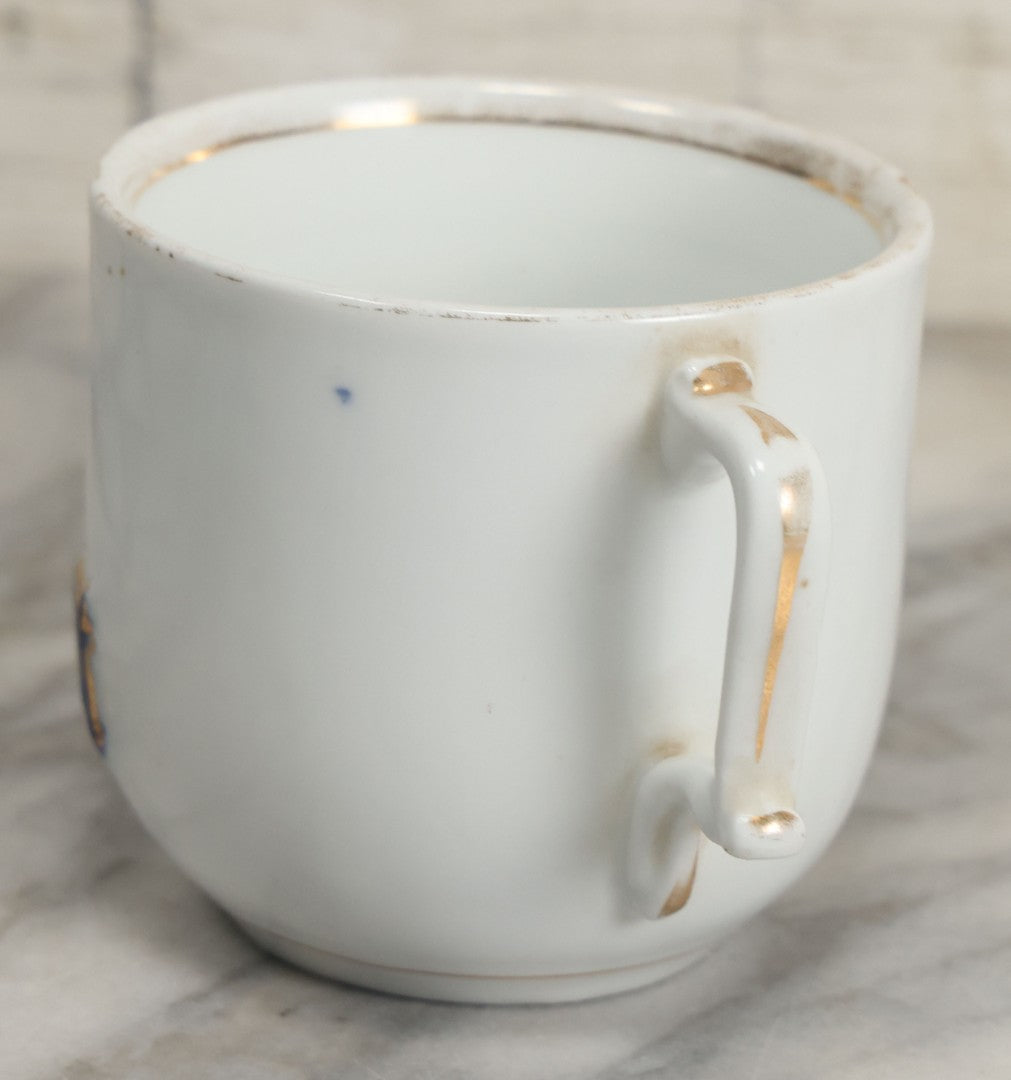 Lot 130 - Antique Porcelain Mug With Blue And Gold "Present" Decoration, Makers Mark On Bottom