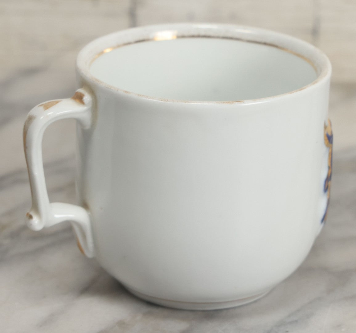 Lot 130 - Antique Porcelain Mug With Blue And Gold "Present" Decoration, Makers Mark On Bottom