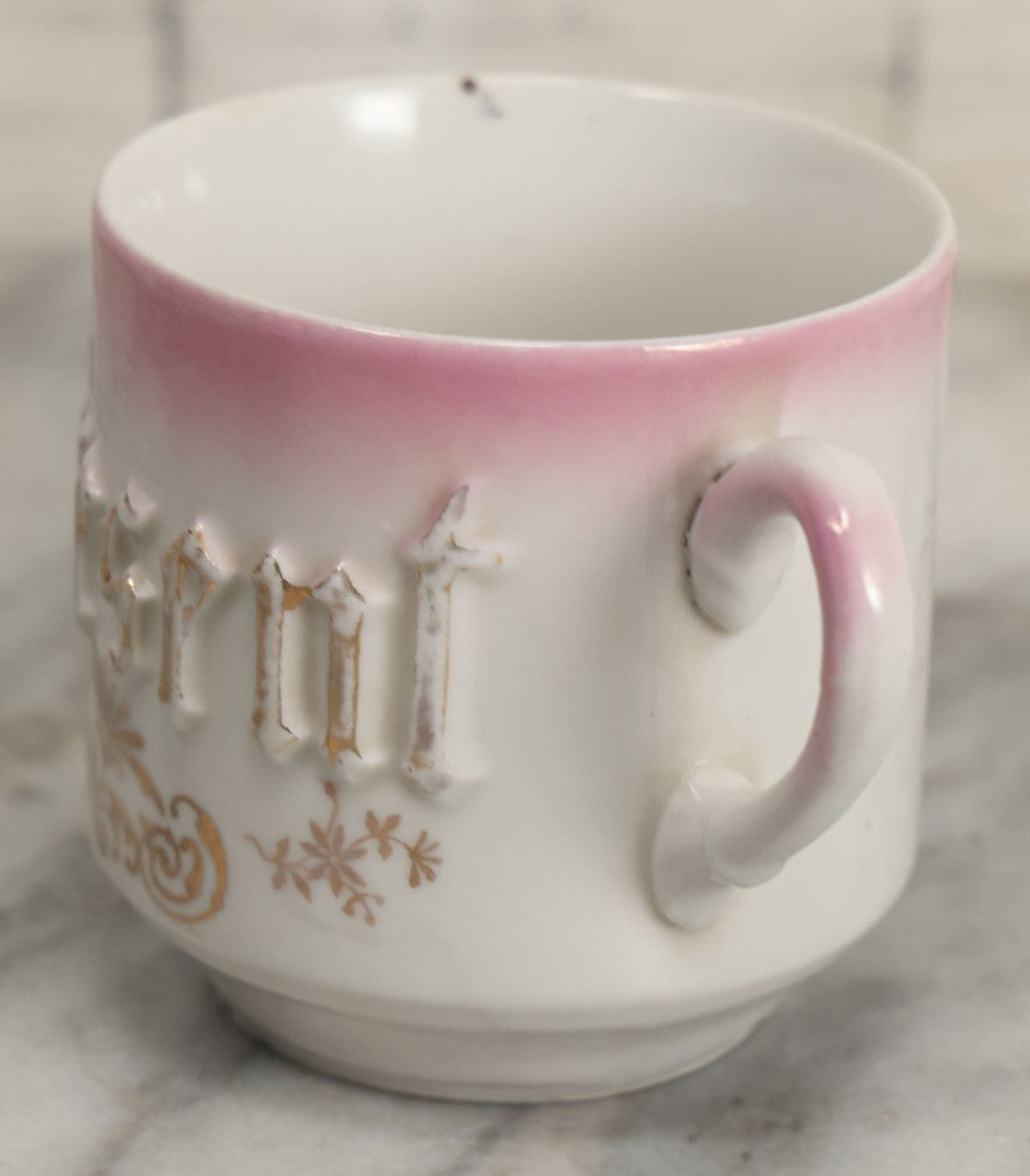 Lot 131 - Antique Porcelain Mug With Pink And Gold "Present" Decoration, Bottom Marked Made In Germany