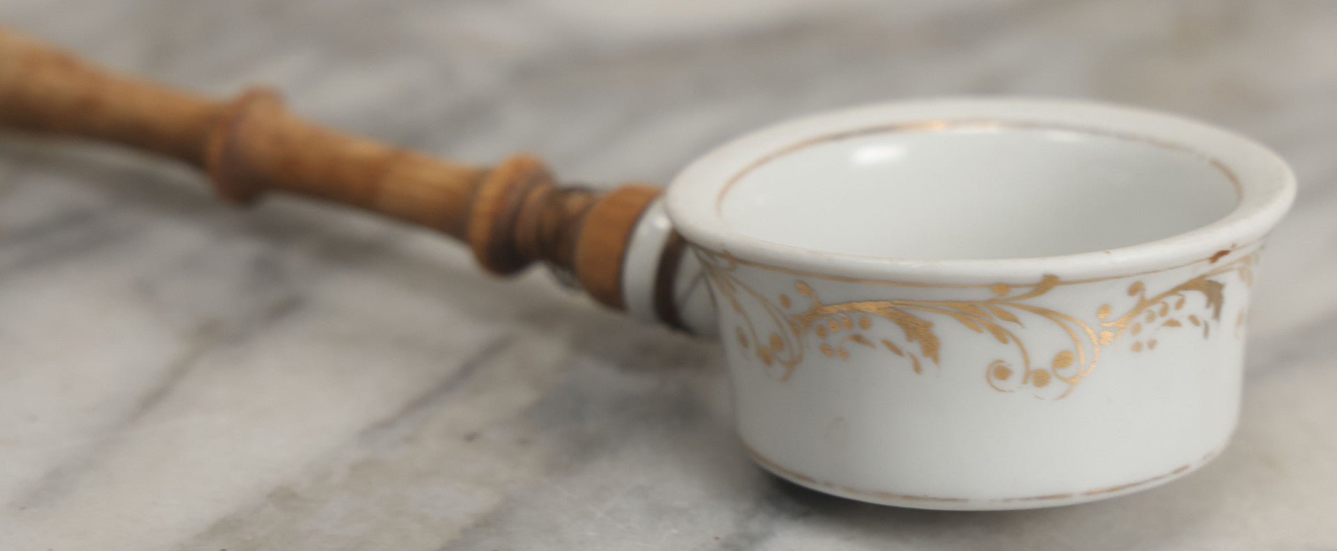 Lot 132 - Vintage Porcelain Tea Strainer With Gold Painted Details And Wire Attached Wooden Handle, Note Repairs