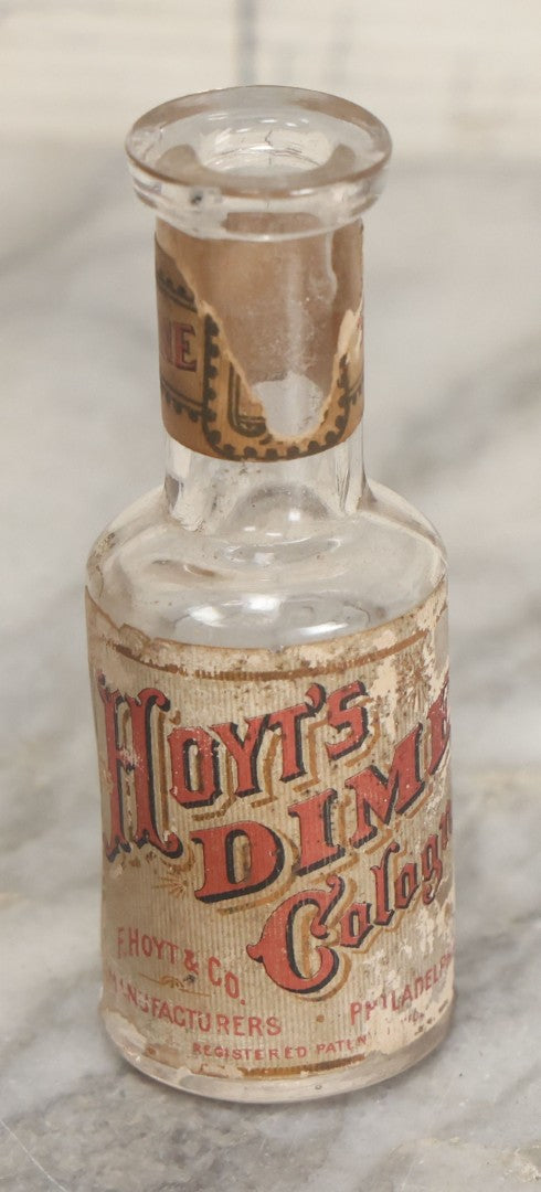 Lot 165 - Eight Piece Vintage Smalls Grouping Including Hoyt's Dime Cologne Bottle, Nixon New Penny Novelty, Ebony And Metal Crucifix, And Other Items