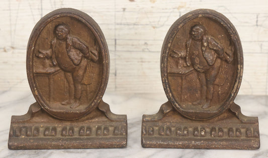 Lot 020 - Antique Cast Iron Bookends Featuring Portly Business Man In Suit With Handout