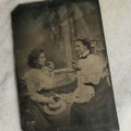 Lot 073 - Single Antique Tintype Photograph Of Two Young Women About To Eat Small Pieces Of Fruit Or Pastry