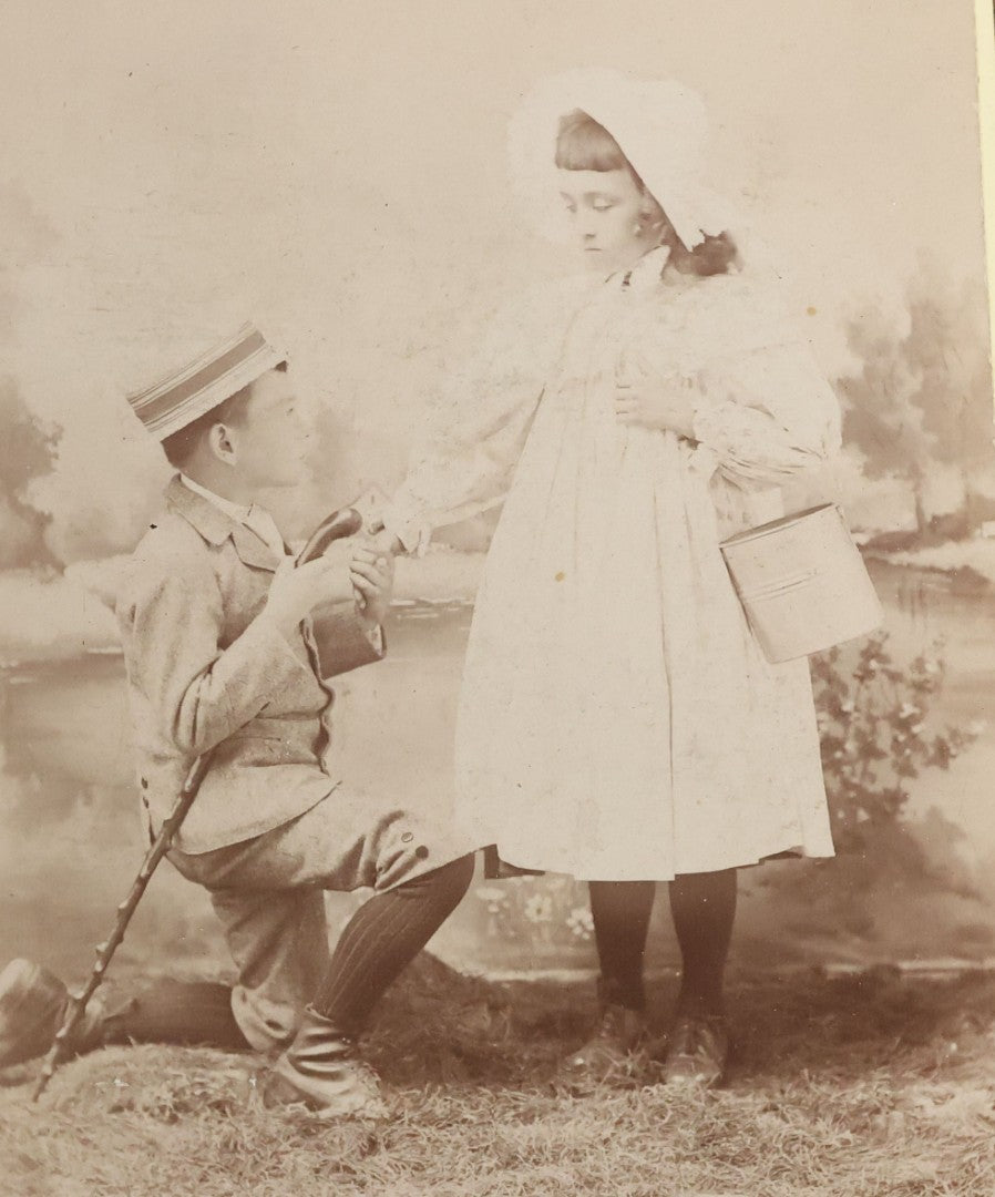 Lot 084 - Antique Cabinet Card Photograph Of Young Boy Courting Young Girl With Handwritten Quote "Will You Marry Me My Pretty Maid", Note On Back "For Lottie Halliday", J.C. Barton, Photographer, Chesley, Ontario