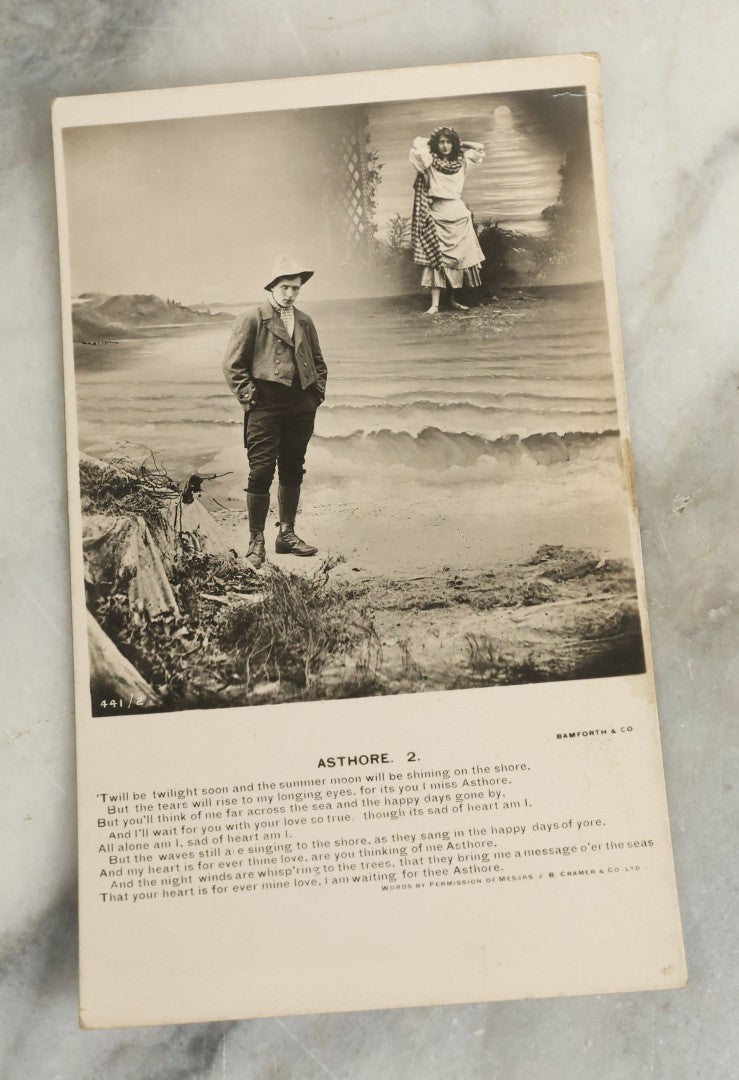 Lot 097 - Grouping Of 35 Antique Photographic Postcards From Bamforth's "Life Model Series," England And New York City, With Many Posed Studio Photographs And Series Including Rock Of Ages, The Little Hero, Excelsior, And Others
