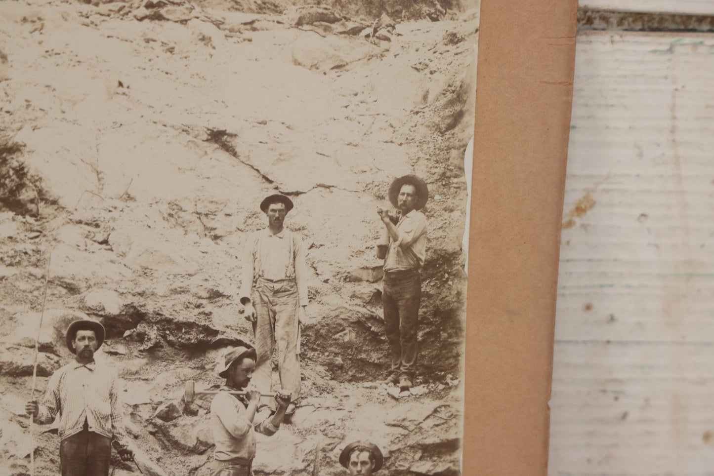 Lot 067 - Antique Boarded Occupational Photograph Of Group Of Seven Miners Posing In Quarry, Holding Sledgehammers And Other Tools