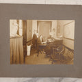 Lot 081 - Antique Boarded Occupational Photograph Of Man In His Office With Map, Sextant, And Telephone Visible In Photo
