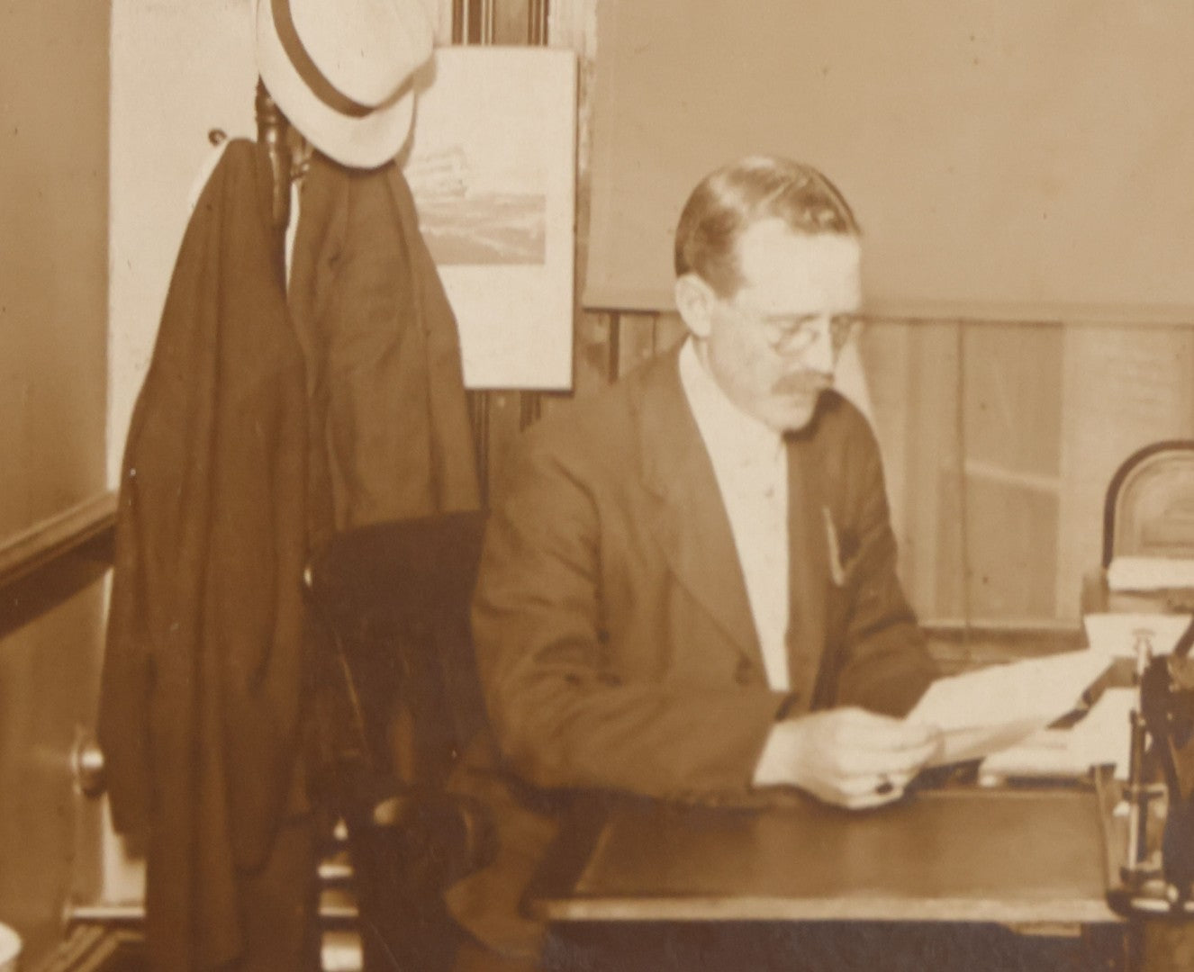 Lot 081 - Antique Boarded Occupational Photograph Of Man In His Office With Map, Sextant, And Telephone Visible In Photo