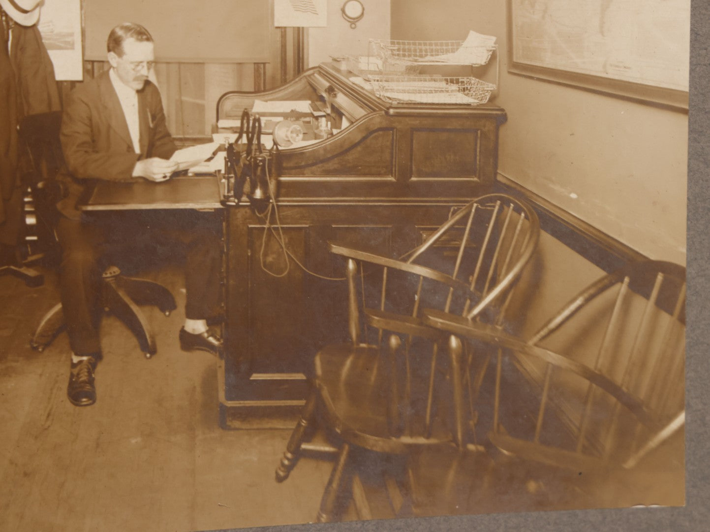 Lot 081 - Antique Boarded Occupational Photograph Of Man In His Office With Map, Sextant, And Telephone Visible In Photo