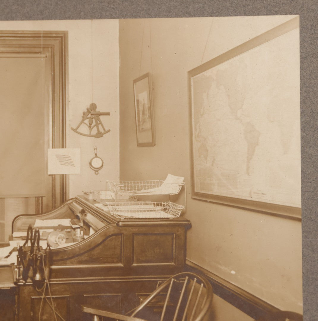 Lot 081 - Antique Boarded Occupational Photograph Of Man In His Office With Map, Sextant, And Telephone Visible In Photo