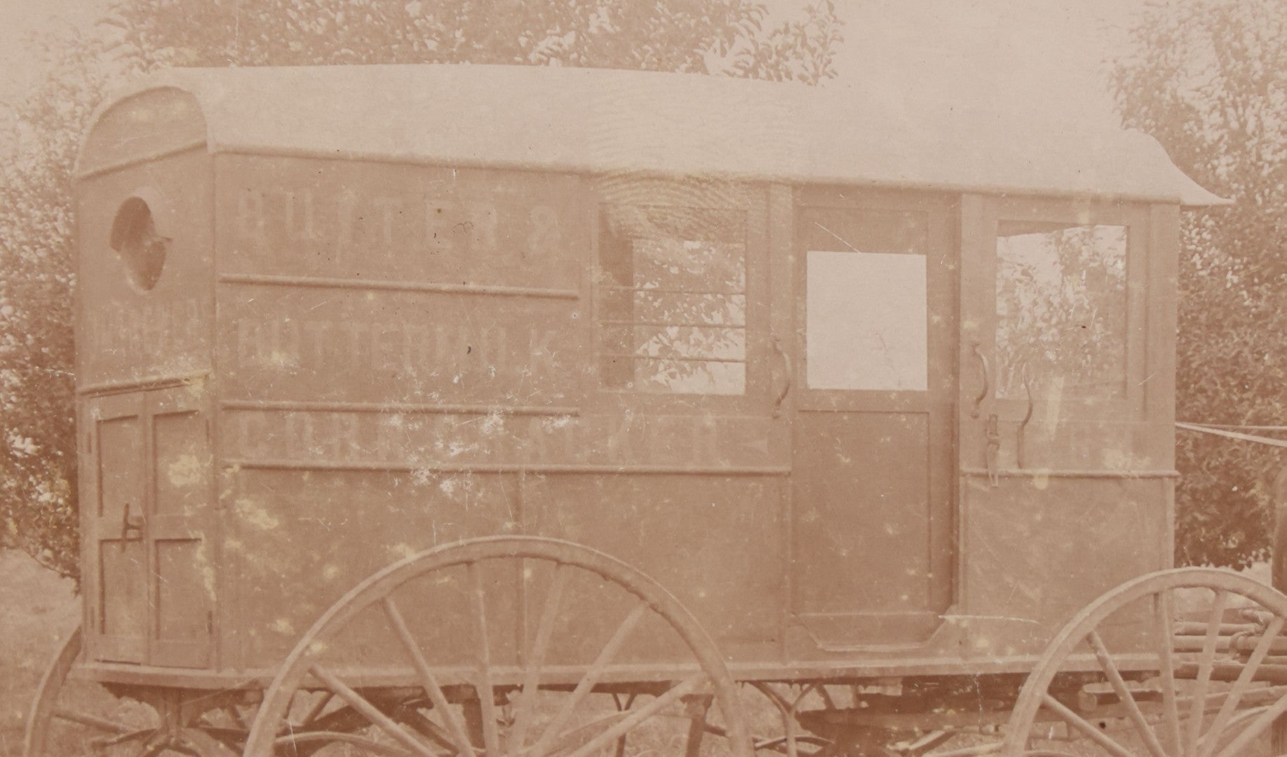 Lot 085 - Antique Boarded Photograph Of Horsedrawn Delivery Wagon Advertising Butter, Buttermilk, Corn, And Crackers