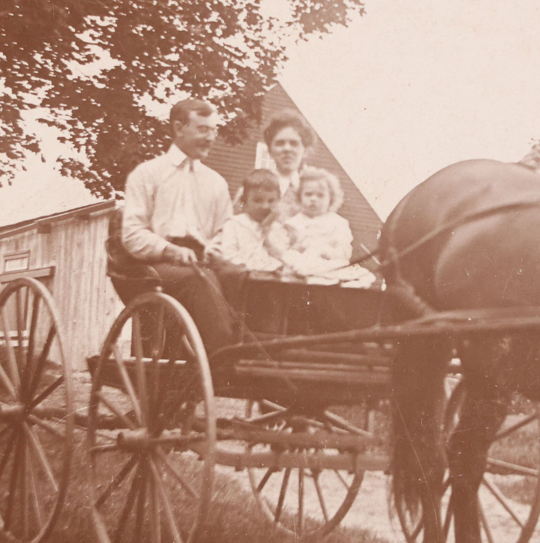 Lot 088 - Antique Boarded Photograph Of Family On Horsedrawn Cart Identified As Herbert & Vivian Eastman And Children Robert Goss & Charles Eastman, Outbuildings Visible In Background