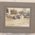 Lot 089 - Antique Boarded Photograph Of Group Of People Posing With And Starting An Early Automobile