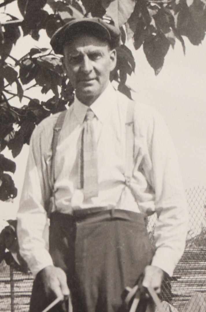 Lot 090 - Vintage Boarded Photograph Of Man In High Waisted Pants With Suspenders Holding Three Hounds On Leashes