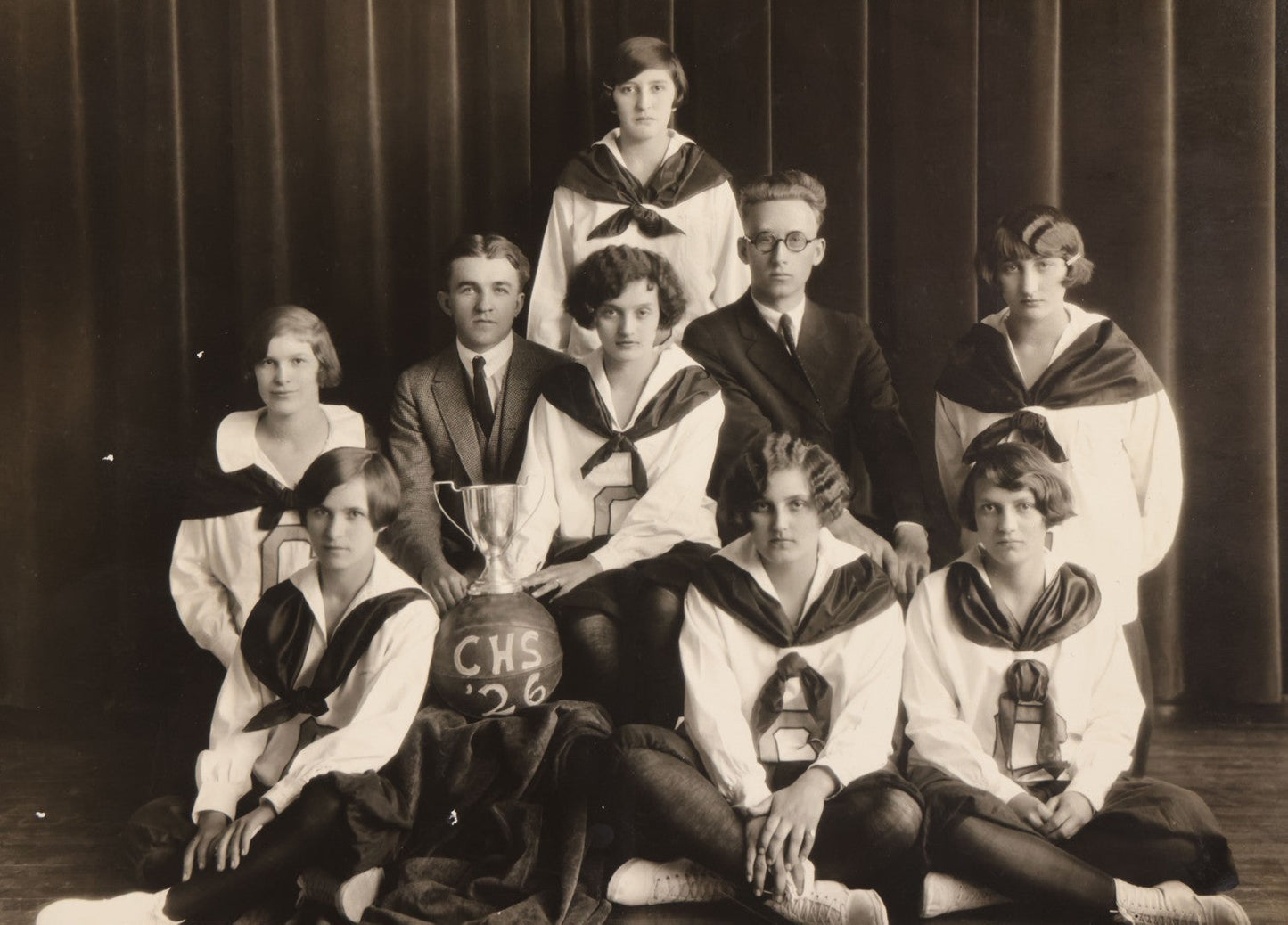Lot 095 - Vintage Photograph In Paper Frame Of Girls Basketball Team Posing With Coaches, Trophy, And Basketball Marked C.H.S. 1926, Likely Catawissa High School, Phillips, Photographer, Bloomsburg, Eagles-Mere, & Danville, Pennsylvania 