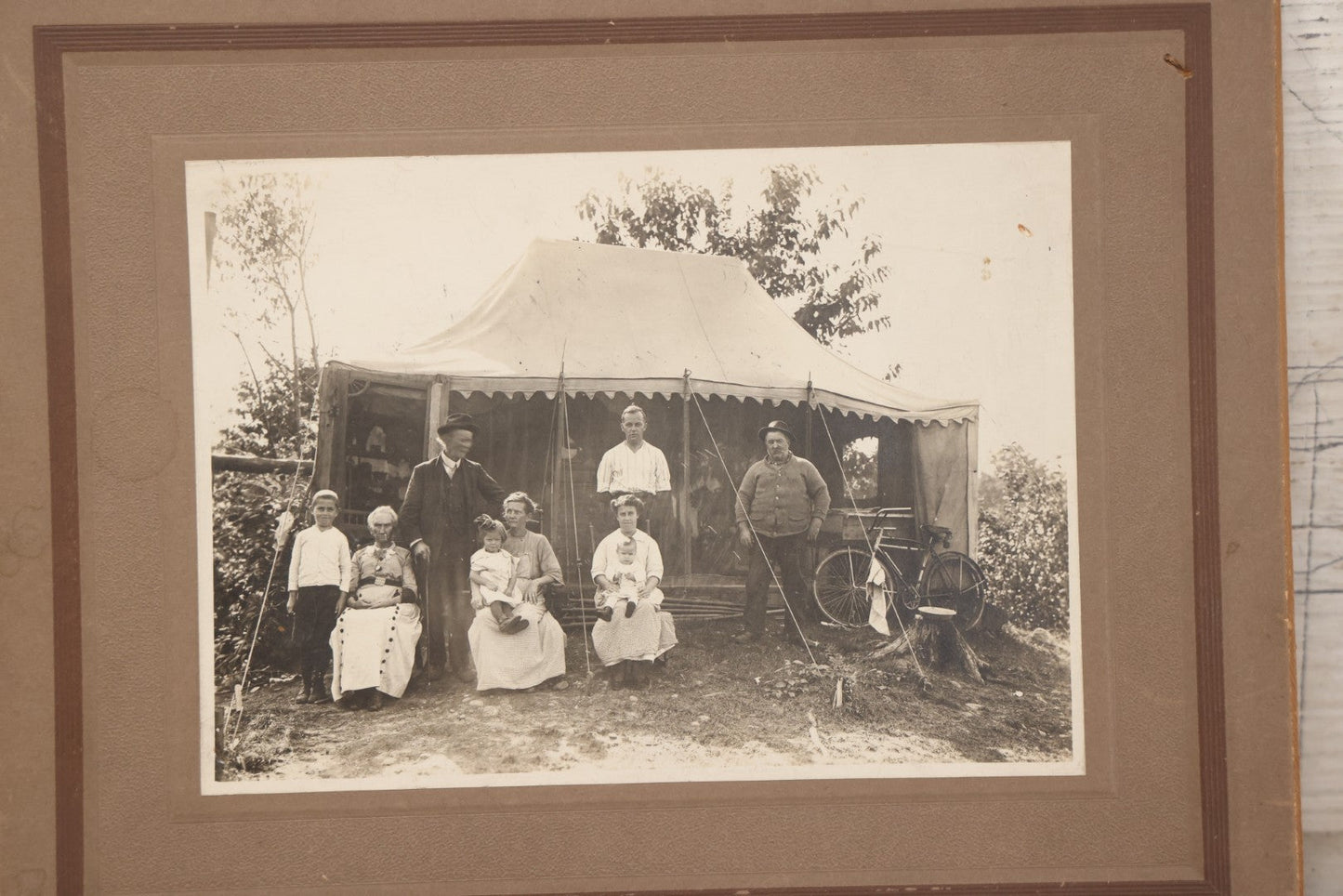 Lot 105 - Antique Boarded Photograph Of Three Generations Of Men Women And Children Posing Outside Of Tent, With Bicycle In Photo