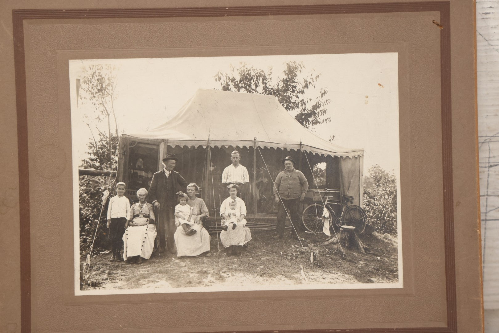 Lot 105 - Antique Boarded Photograph Of Three Generations Of Men Women And Children Posing Outside Of Tent, With Bicycle In Photo