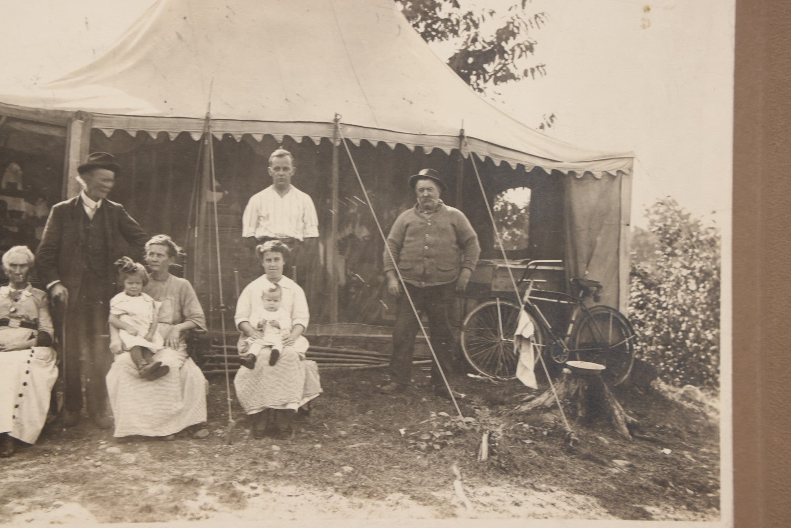 Lot 105 - Antique Boarded Photograph Of Three Generations Of Men Women And Children Posing Outside Of Tent, With Bicycle In Photo