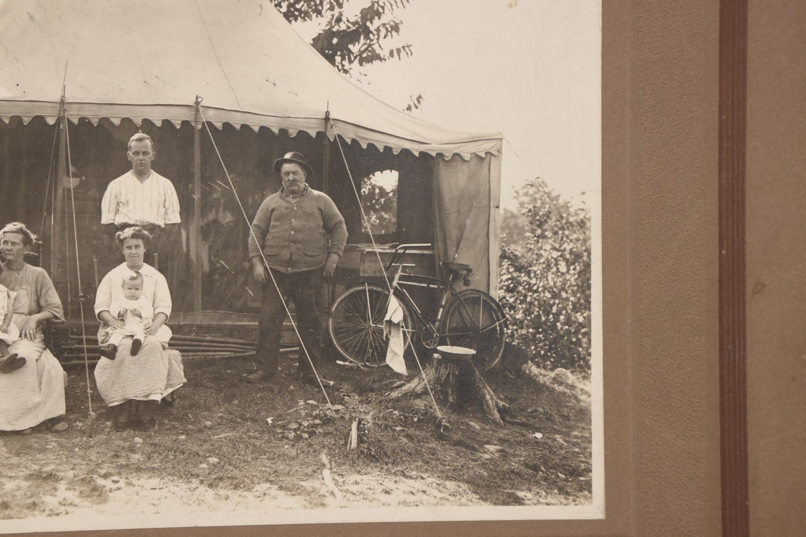 Lot 105 - Antique Boarded Photograph Of Three Generations Of Men Women And Children Posing Outside Of Tent, With Bicycle In Photo