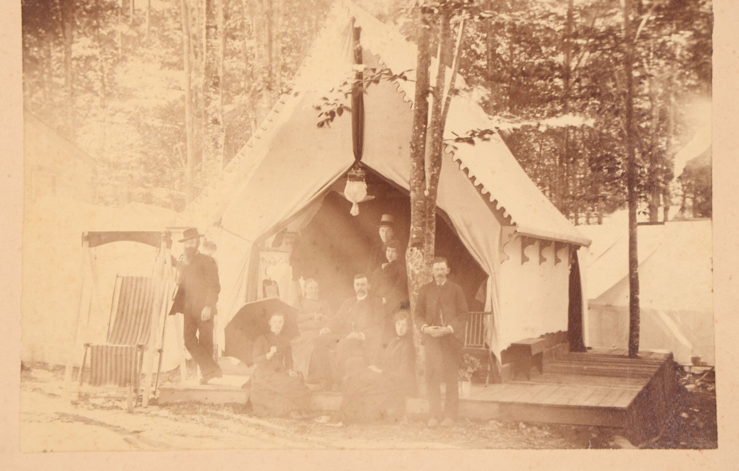 Lot 106 - Antique Boarded Photograph Of Men And Women Posing Outside Tent On Platform In Tent Village